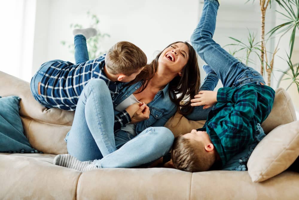 Mother and sons bonding at home.